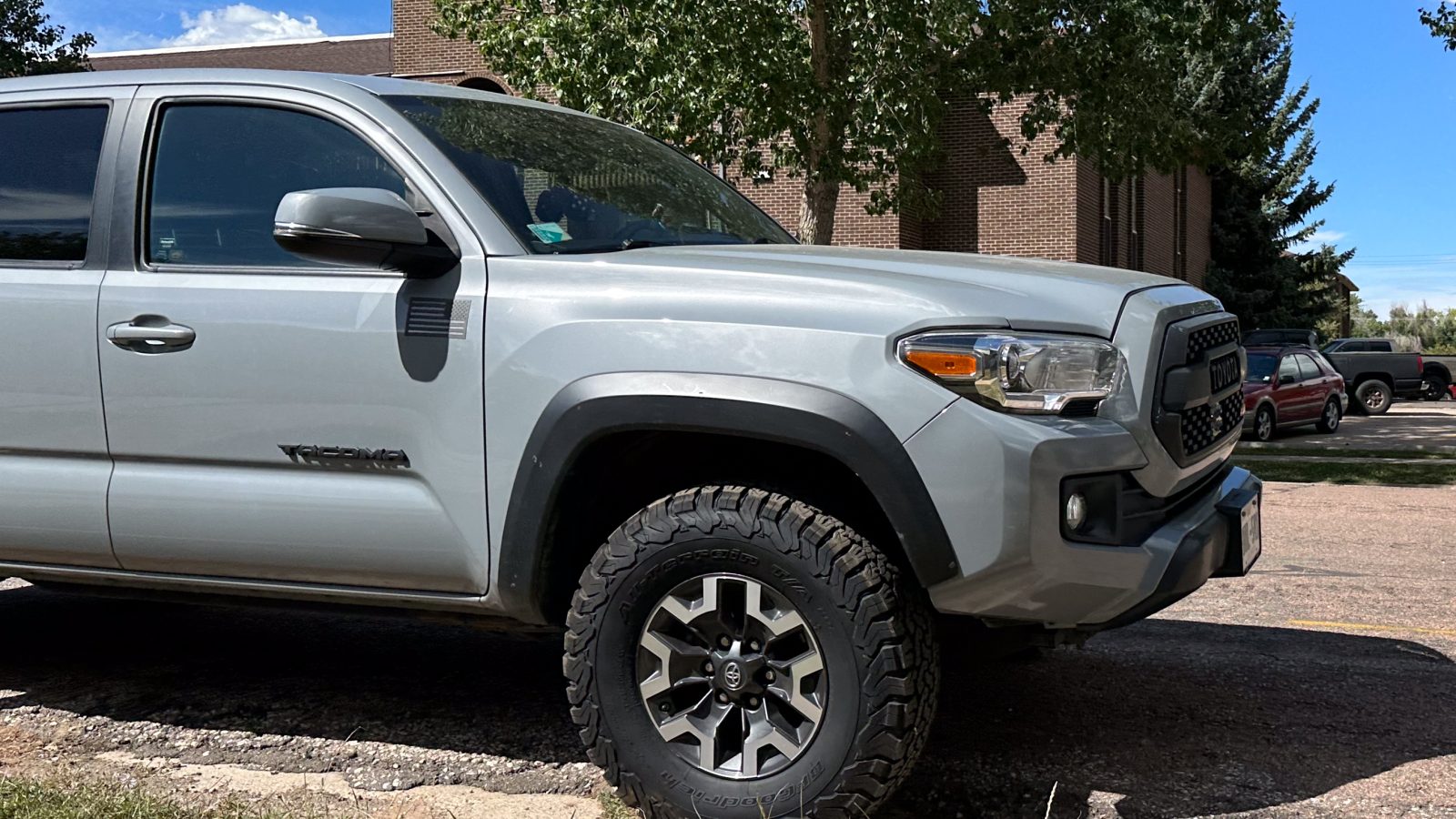 A Toyota Tacoma pickup truck parked outdoors, viewed from the front three-quarter angle
