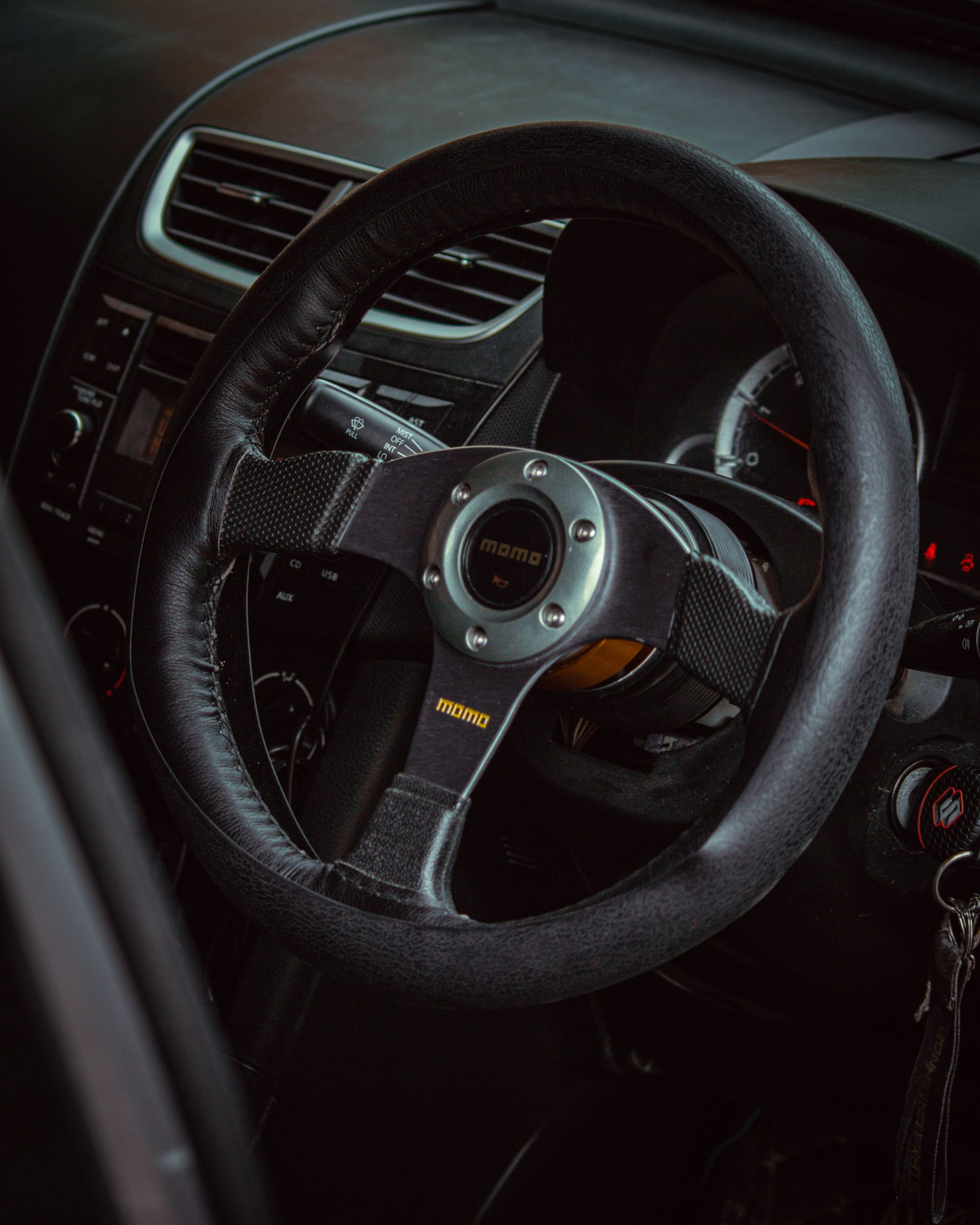 Close-up shot of a black steering wheel