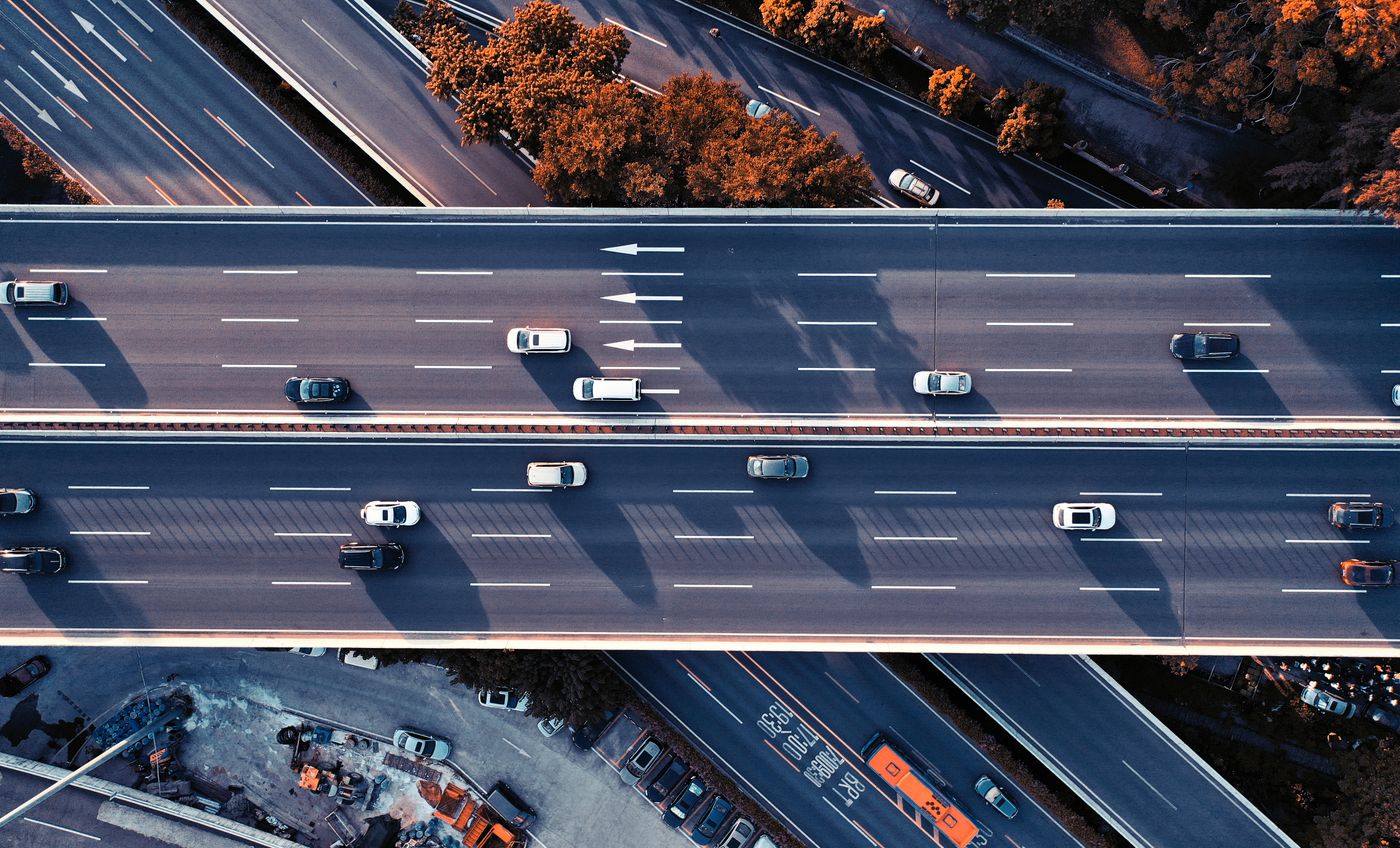 Multiple lanes of traffic on an elevated highway viaduct with no cross streets