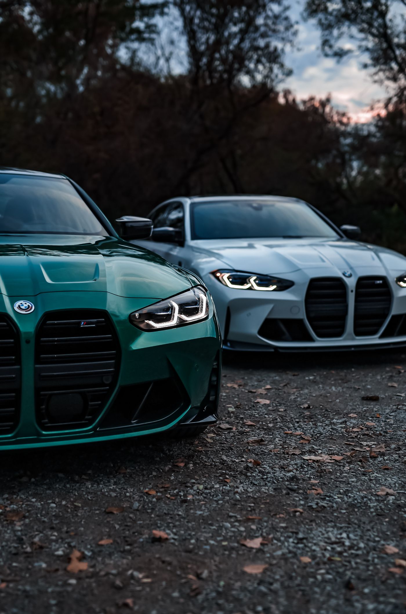 Two BMW M3 sedans parked side by side showing the twin-kidney grille