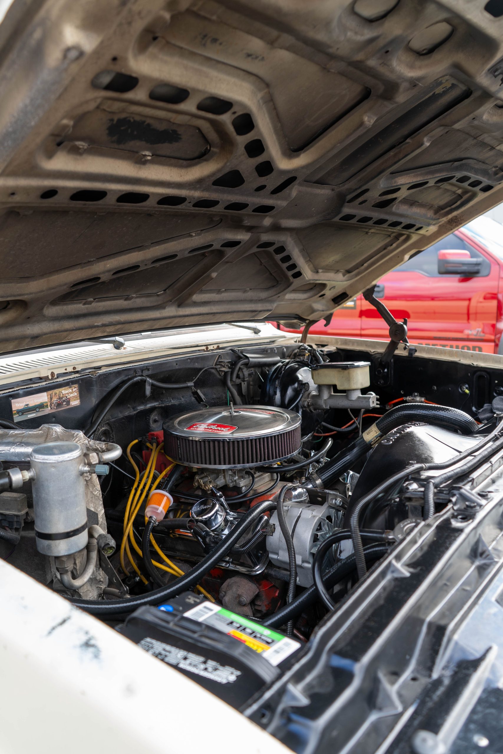 Close-up of a car engine bay with the hood open