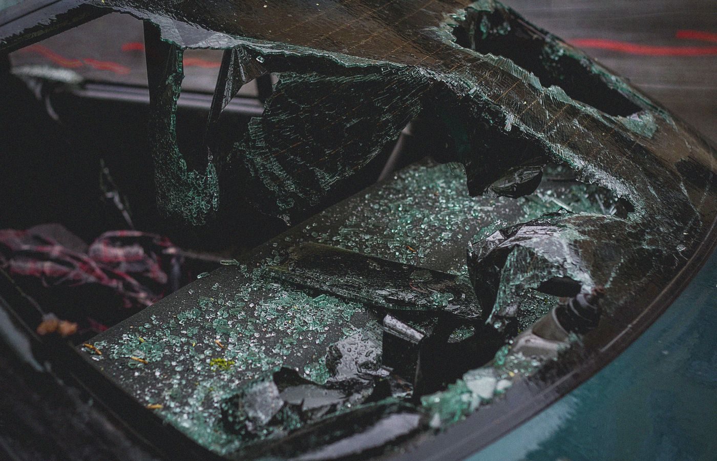 Shattered automotive glass on a vehicle after impact damage