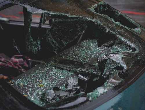 Shattered automotive glass on a vehicle after impact damage