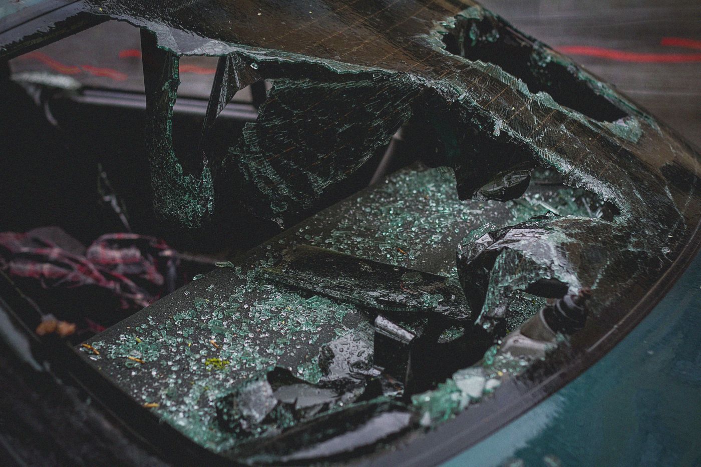 Shattered automotive glass on a vehicle after impact damage