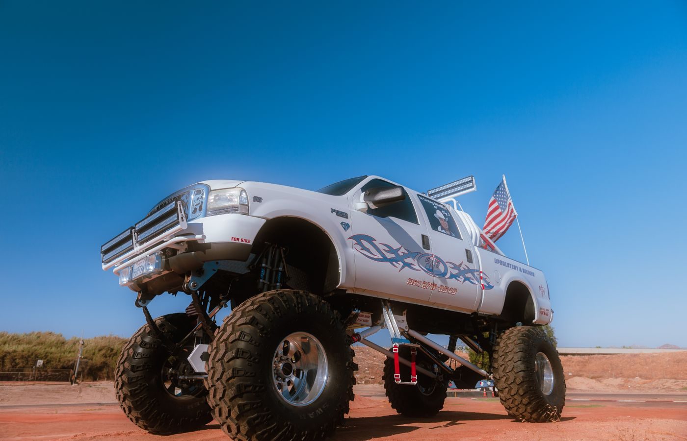 Heavily lifted off-road truck with large tires