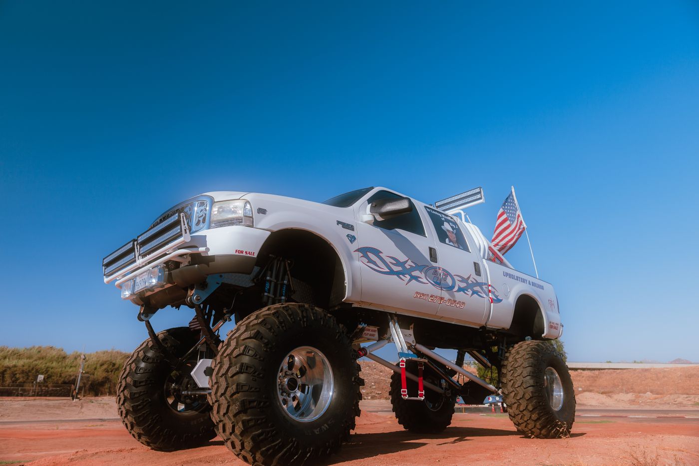 Heavily lifted off-road truck with large tires