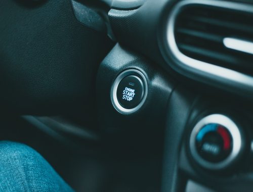 Close-up of a modern car interior with engine start button