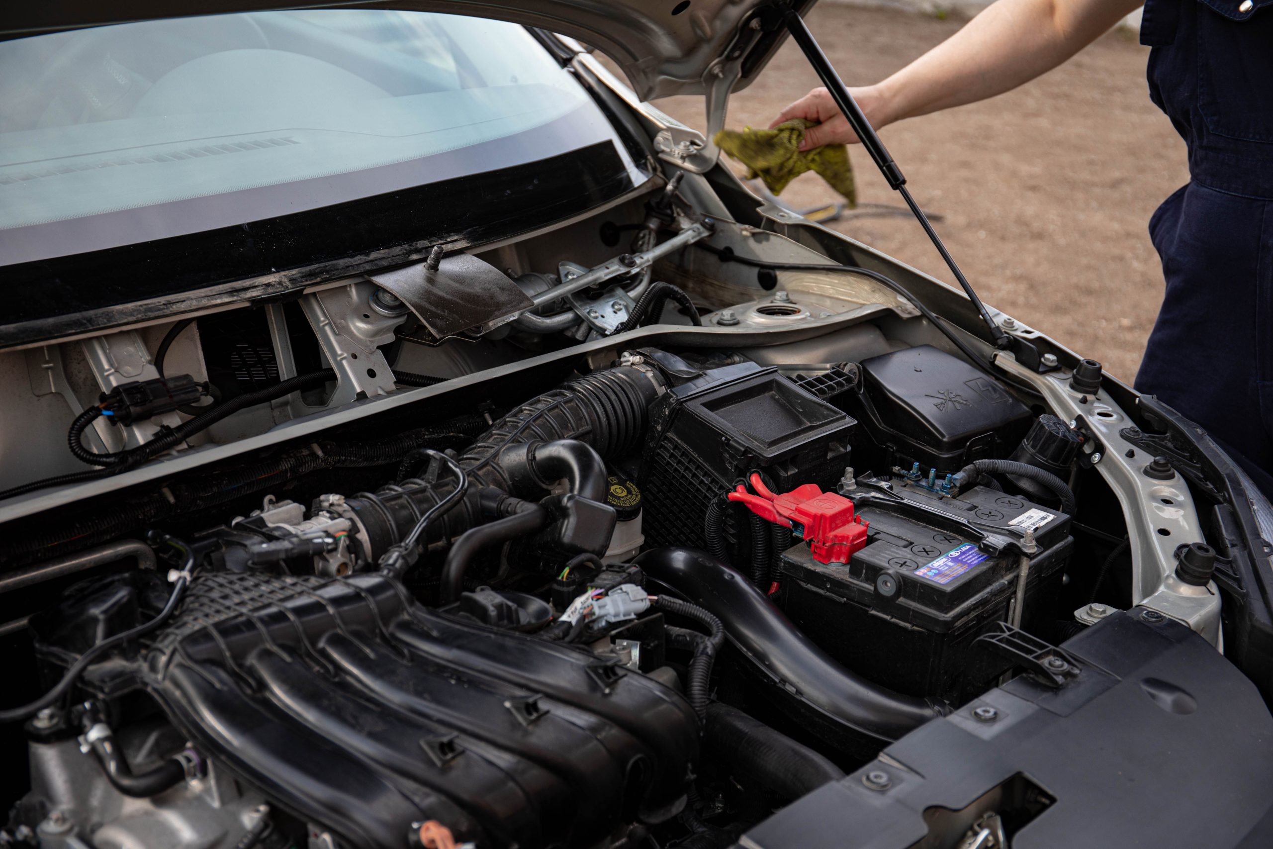 Open hood of a car showing the engine bay