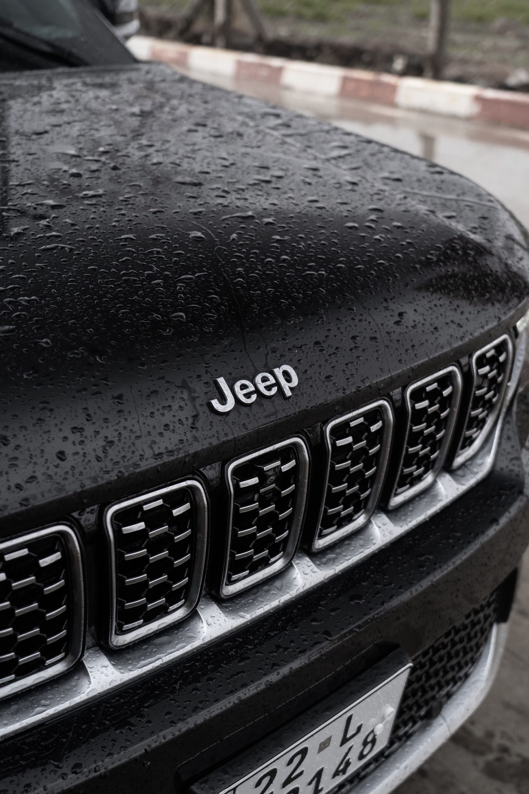 Water droplets beading on a car surface