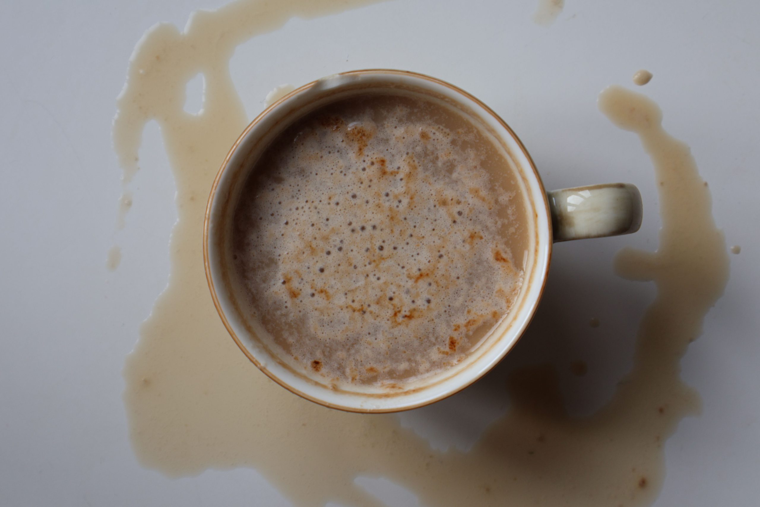 Overhead view of a spilled coffee cup