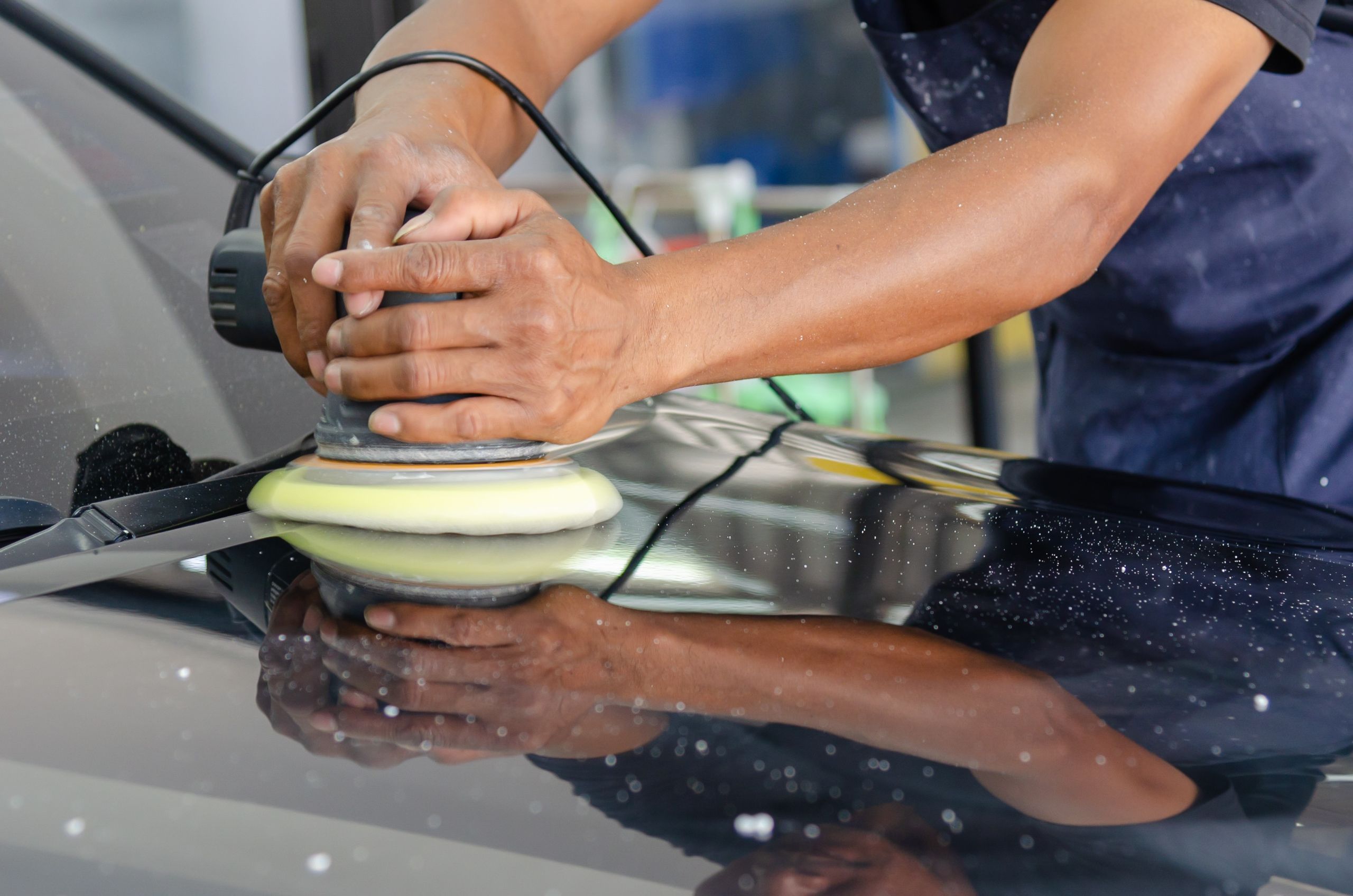 Close-up of a car paint scratch on the surface