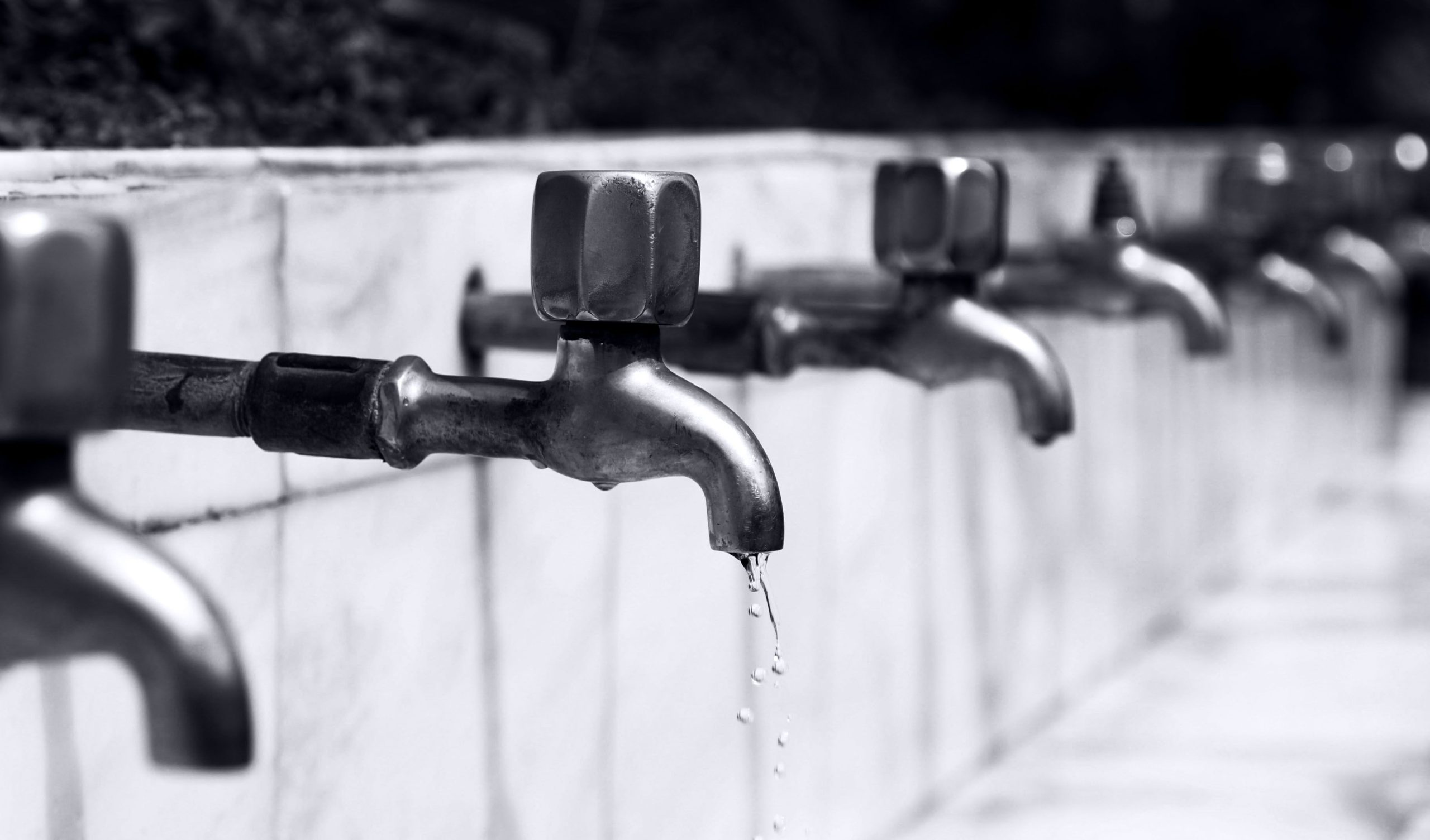 Water drops from a faucet