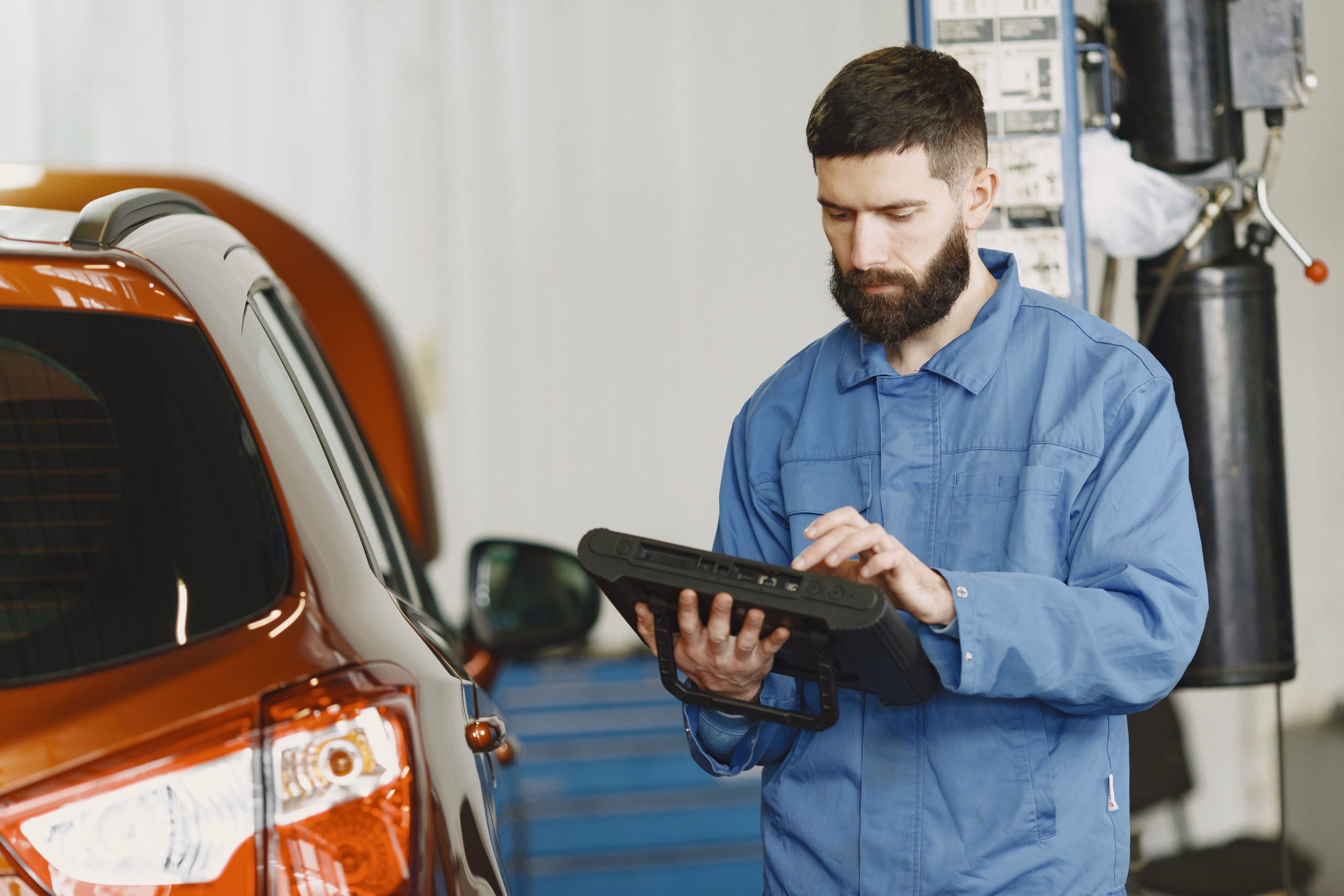 Person browsing used car listings on a laptop