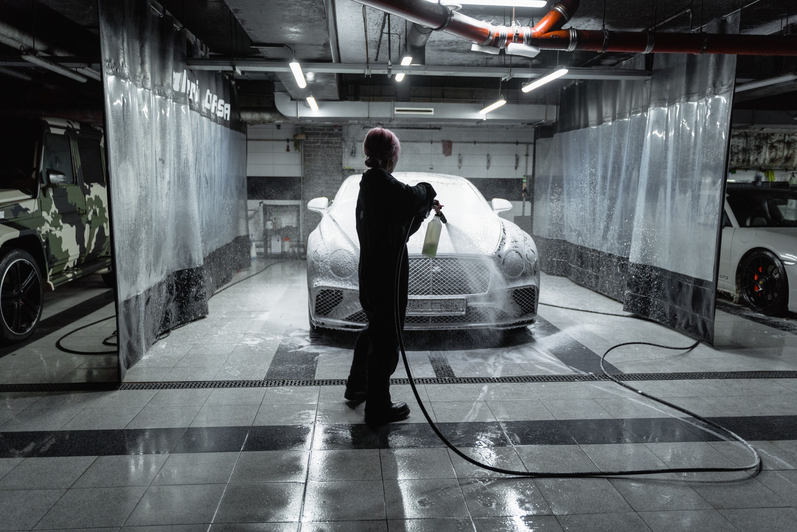 Snow foam being applied to a car during a wash