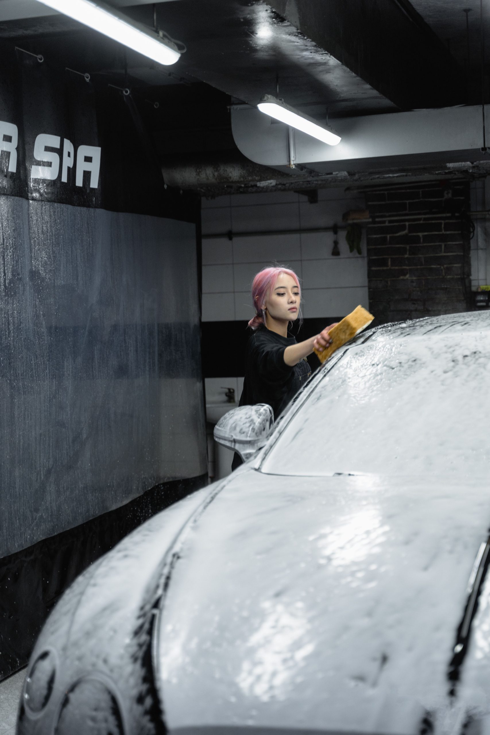Washing a car with a sponge